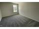 Bedroom featuring a large window, carpet and neutral paint at 111 Magnolia Run Way, Benson, NC 27504
