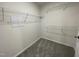 Walk-in closet with carpet and built-in white wire shelving at 111 Magnolia Run Way, Benson, NC 27504