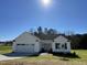 Charming one story home with well-manicured lawn and two car garage at 111 Magnolia Run Way, Benson, NC 27504