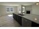 Gourmet kitchen island features a double sink and stainless steel dishwasher at 111 Magnolia Run Way, Benson, NC 27504