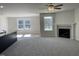 Spacious living room features a fireplace, ceiling fan, and lots of natural light at 111 Magnolia Run Way, Benson, NC 27504