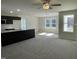 Open concept living area with lots of natural light flowing into the kitchen area at 111 Magnolia Run Way, Benson, NC 27504