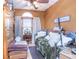 Bedroom with hardwood floors, natural light from arched window, and comfortable furnishings at 111 Preakness Dr, Archer Lodge, NC 27527