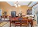 Comfortable dining room with chandelier lighting and traditional furniture at 111 Preakness Dr, Archer Lodge, NC 27527