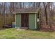 Backyard shed features a covered entrance and wooden construction, providing storage and utility at 111 Preakness Dr, Archer Lodge, NC 27527