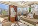 Inviting sunroom with lots of natural light, comfortable seating, and decorative accents for relaxation at 111 Preakness Dr, Archer Lodge, NC 27527