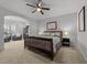 Main bedroom with ample natural light, a sitting area, and an en-suite bathroom at 1222 Restoration Dr, Durham, NC 27703