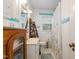 Cozy bathroom with white wainscoting, a classic sink and vintage medicine cabinet at 1303 Rainy St, Burlington, NC 27217