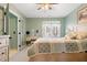 Bedroom with window and desk/vanity set and ensuite bathroom access at 1414 Mahonia Ct, Raleigh, NC 27615