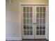 Bonus room featuring a pair of french doors, hardwood floors, and neutral paint at 1414 Reading Ct # 91Kl, Burlington, NC 27217