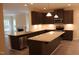 Modern kitchen featuring granite counters, stainless steel appliances, and a center island for enhanced food preparation at 1414 Reading Ct # 91Kl, Burlington, NC 27217