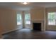 Living room featuring a marble fireplace, hardwood floors, and a neutral color palette at 1414 Reading Ct # 91Kl, Burlington, NC 27217