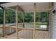 Comfortable screened-in porch constructed with wood, perfect for relaxed outdoor living and shaded enjoyment at 1414 Reading Ct # 91Kl, Burlington, NC 27217