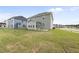 Large backyard with green lawn and patio at 15 Nimble Way # 175, Clayton, NC 27520