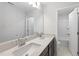 Bathroom features a double vanity with quartz countertops and modern chrome fixtures at 15 Nimble Way # 175, Clayton, NC 27520