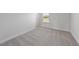 Well-lit bedroom with plush carpeting, neutral walls, and a bright window view at 15 Nimble Way # 175, Clayton, NC 27520
