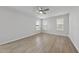 Bright bedroom features three windows and a ceiling fan at 15 Nimble Way # 175, Clayton, NC 27520