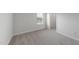 Bright bedroom with plush carpet, neutral walls, and a closet at 15 Nimble Way # 175, Clayton, NC 27520