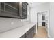Stylish kitchen counter featuring quartz countertops, modern cabinets, and tile backsplash at 15 Nimble Way # 175, Clayton, NC 27520