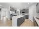 Open kitchen featuring gray cabinets, stainless steel appliances, and a large center island at 15 Nimble Way # 175, Clayton, NC 27520