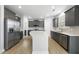 Spacious kitchen featuring stainless steel appliances, a large island, and gray cabinetry at 15 Nimble Way # 175, Clayton, NC 27520