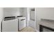 Modern laundry room with granite countertop and new washer and dryer at 15 Nimble Way # 175, Clayton, NC 27520