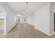 Spacious living room boasts modern lighting and luxury vinyl plank flooring at 15 Nimble Way # 175, Clayton, NC 27520