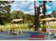Bright and colorful playground with swings, benches, and a soft surface at 15 Nimble Way # 175, Clayton, NC 27520