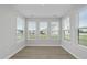 Cozy sunroom with luxury vinyl plank flooring and large windows at 15 Nimble Way # 175, Clayton, NC 27520