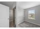 Bright walk-in closet includes shelving, mirrored door, and a window for natural light at 15 Nimble Way # 175, Clayton, NC 27520