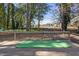 Backyard wooden deck with putting green for outdoor entertainment at 1721 Kingston Heath Way, Raleigh, NC 27604