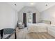 Bright bedroom with vaulted ceilings, gray walls, arched window with curtains, crib, and white furniture at 1721 Kingston Heath Way, Raleigh, NC 27604