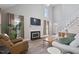 Bright living room with a fireplace, soaring ceilings, and hardwood floors at 1721 Kingston Heath Way, Raleigh, NC 27604