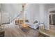 Cozy living room with hardwood floors, comfortable seating, and bright natural light at 1721 Kingston Heath Way, Raleigh, NC 27604