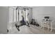 Bonus room area includes a bay window, exercise equipment, a desk and chair, and light gray floors at 1721 Kingston Heath Way, Raleigh, NC 27604