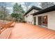 Spacious backyard deck perfect for relaxation and outdoor gatherings; features built-in bench seating at 1824 S Lakeshore Dr, Chapel Hill, NC 27514