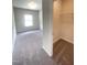 Bedroom featuring gray carpet and neutral walls, with a walk-in closet at 195 Deodora Ln, Cameron, NC 28326