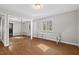 Bedroom with mirrored closet, desk area, and outside access to a private balcony at 2107 Markham Dr, Chapel Hill, NC 27514