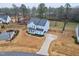 Aerial view of a two-story home with a well-manicured front yard at 213 W Weatherford Dr, Angier, NC 27501