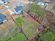 Aerial view of a fenced backyard with mature trees offering privacy at 213 W Weatherford Dr, Angier, NC 27501