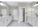 Modern bathroom features double vanities and separate toilet rooms for added privacy and convenience at 213 W Weatherford Dr, Angier, NC 27501