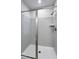 Modern bathroom featuring a sleek glass-enclosed shower with gray subway tile surround at 213 W Weatherford Dr, Angier, NC 27501