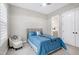 Bright bedroom features a ceiling fan, carpeting, and a stylish chair at 213 W Weatherford Dr, Angier, NC 27501