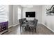 Elegant dining room with glass table, upholstered chairs, and modern chandelier at 213 W Weatherford Dr, Angier, NC 27501