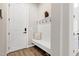 Entryway featuring a bench with coat hooks, a door, and wood-look flooring at 213 W Weatherford Dr, Angier, NC 27501