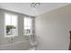 Foyer featuring an elaborate chandelier, two windows and ample natural lighting at 213 W Weatherford Dr, Angier, NC 27501