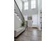 Bright foyer with staircase, modern lighting, and elegant decor at 213 W Weatherford Dr, Angier, NC 27501