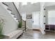 Elegant foyer with hardwood floors, staircase, and stylish decor at 213 W Weatherford Dr, Angier, NC 27501