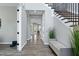 Spacious hallway featuring hardwood floors, neutral walls, and ample natural light at 213 W Weatherford Dr, Angier, NC 27501