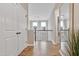 Upstairs hallway showcasing hardwood floors, staircase, and access to bedrooms at 213 W Weatherford Dr, Angier, NC 27501